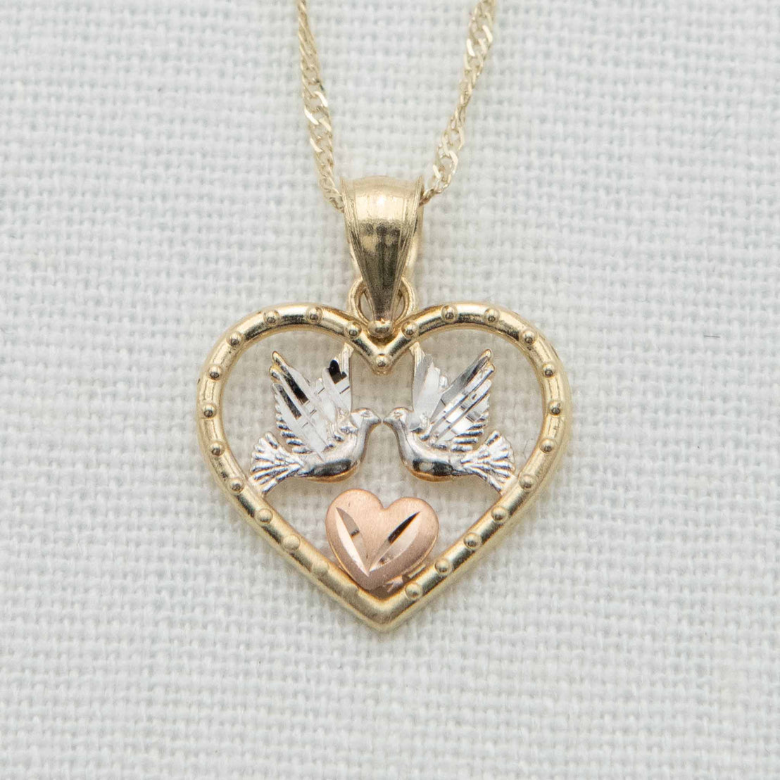  Gold heart with white gold doves and rose gold heart detail on chain