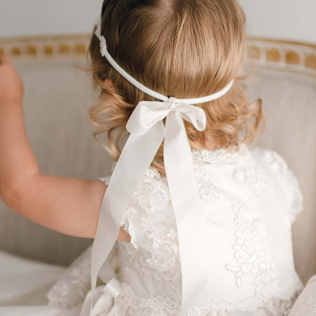 Back of the detail of the full-length bow on the baptism headband. 