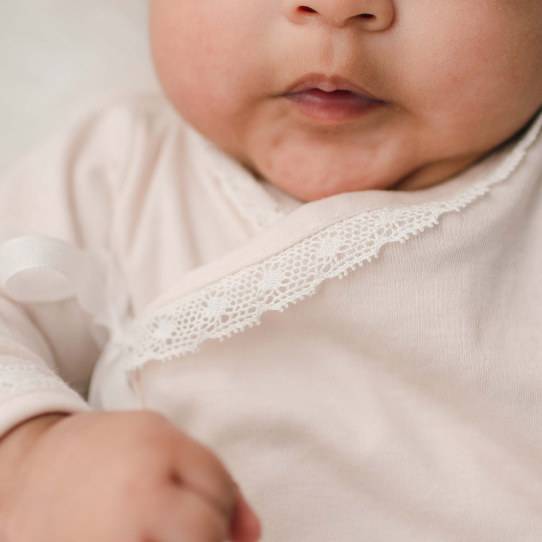 Pink cotton layette bodice lace detail