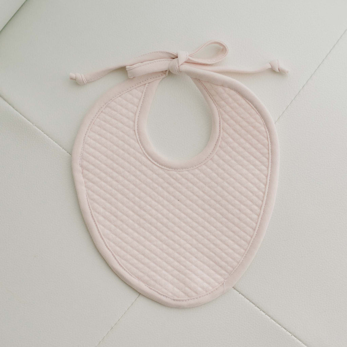 Blush pink cotton bib for newborn