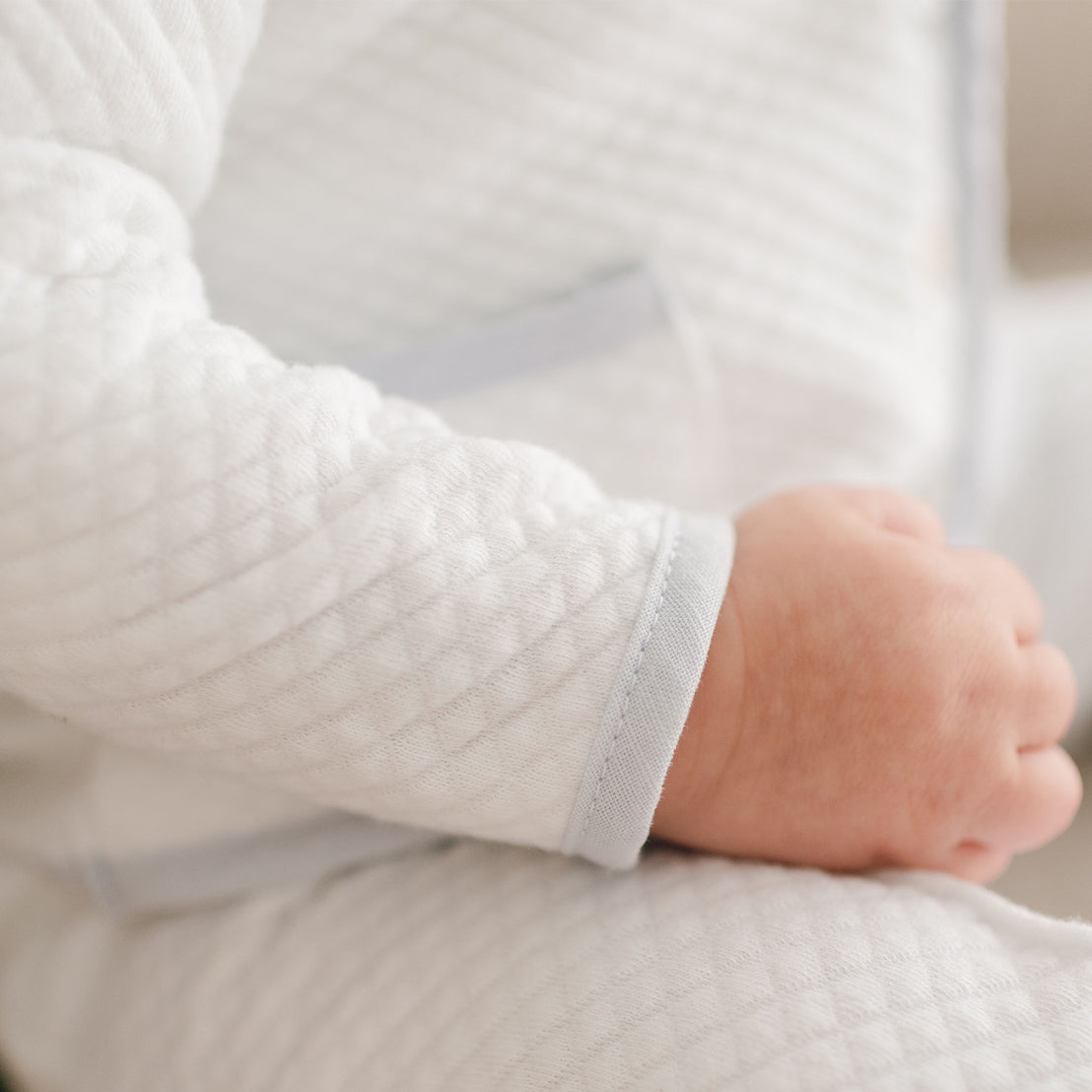 Close-up view of a person wearing an Harrison 3-Piece Suit with their hands gently folded in their lap.