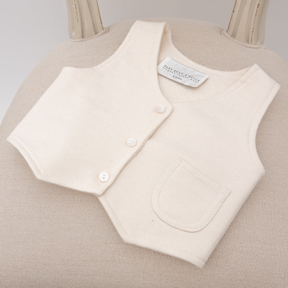 Flat lay baby boy tan vest