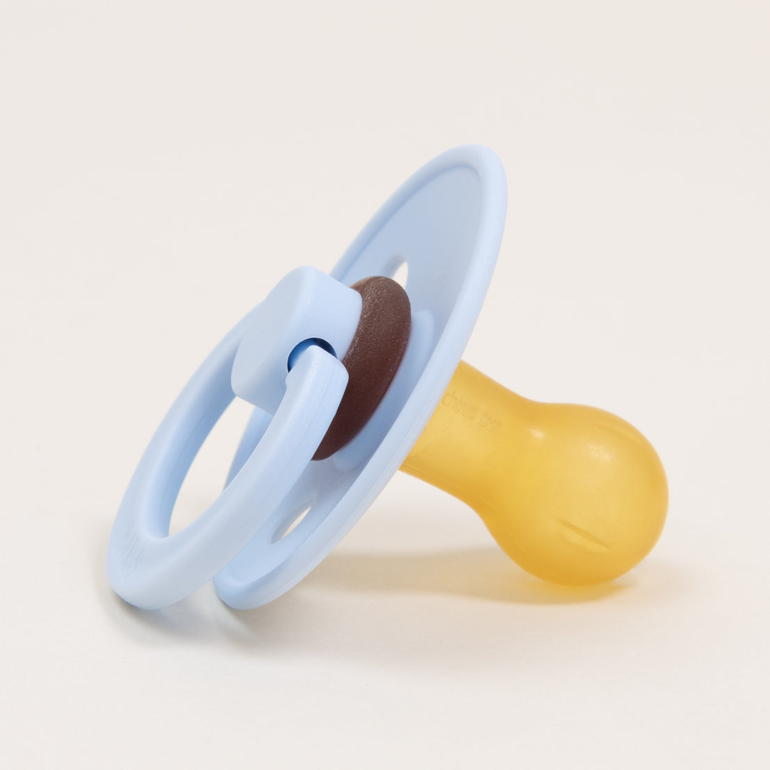 An Ian Pacifier accessory with a light blue handle and a yellow silicone nipple, isolated on a white background.