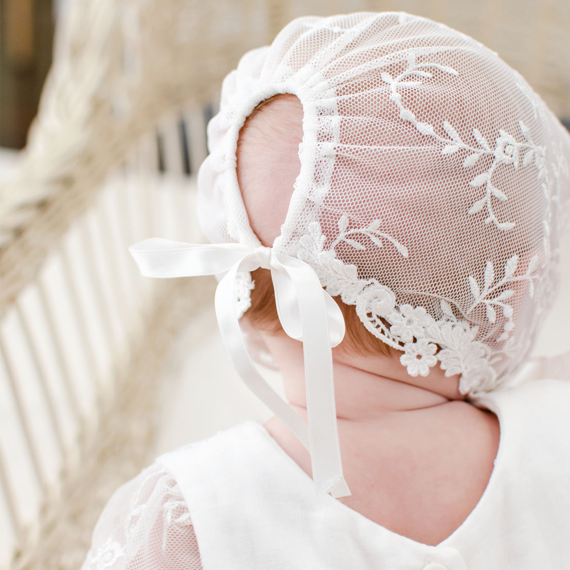 Close-up of the back of the Ella Lace Bonnet, featuring silk ribbon ties.