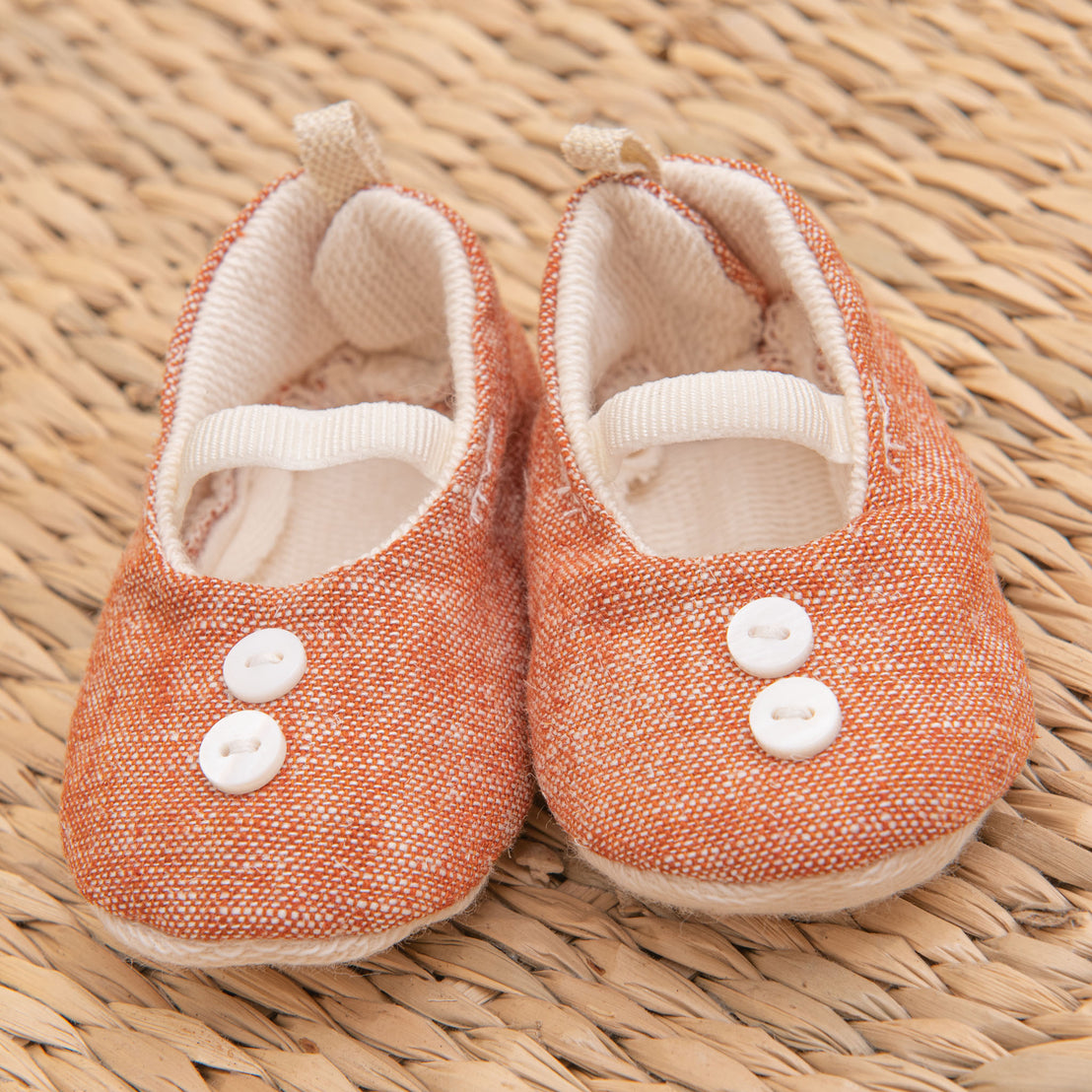 Flat lay photo of the red Silas Linen Booties made from french terry cotton