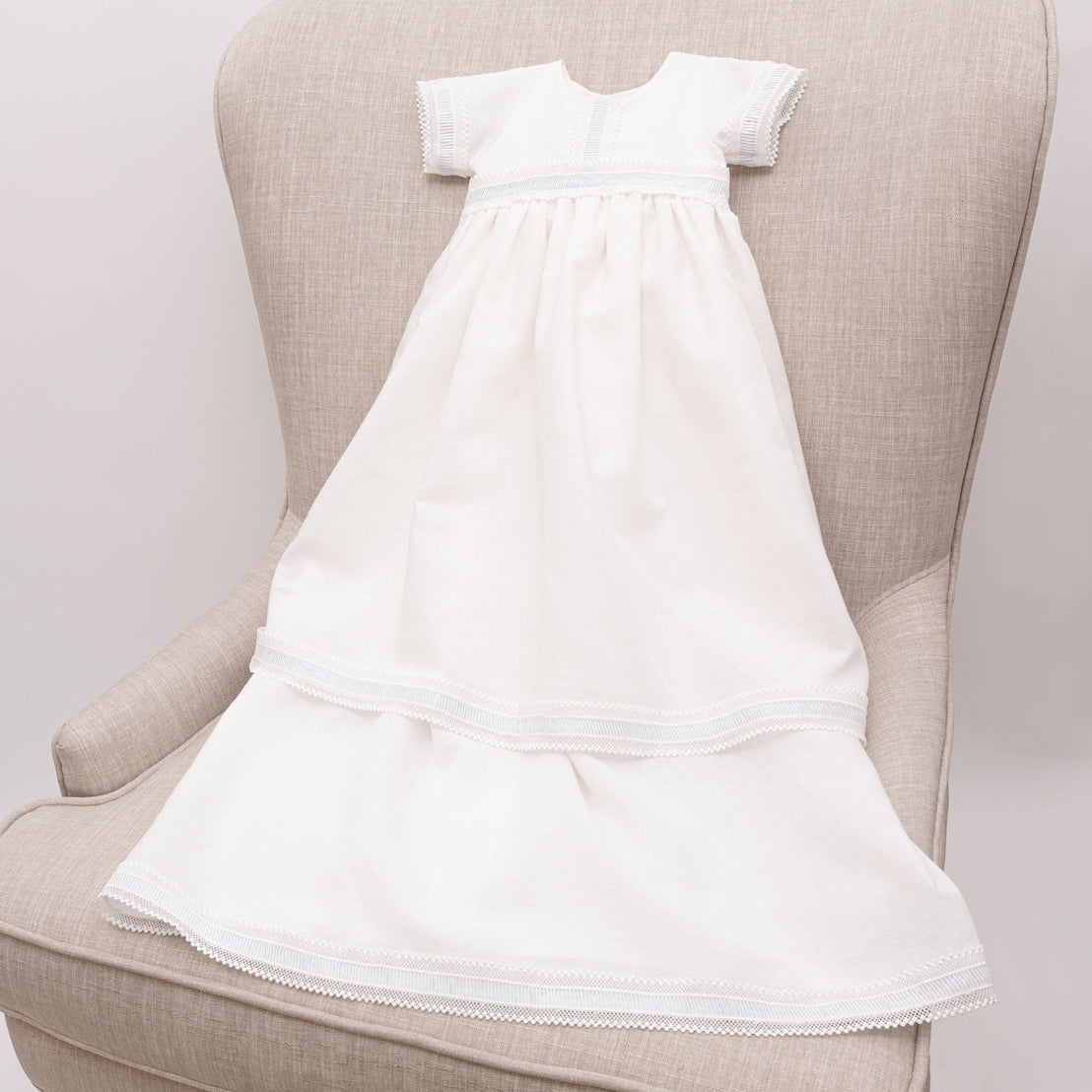 Full length photo of the Rowan convertible linen boys baptism gown.