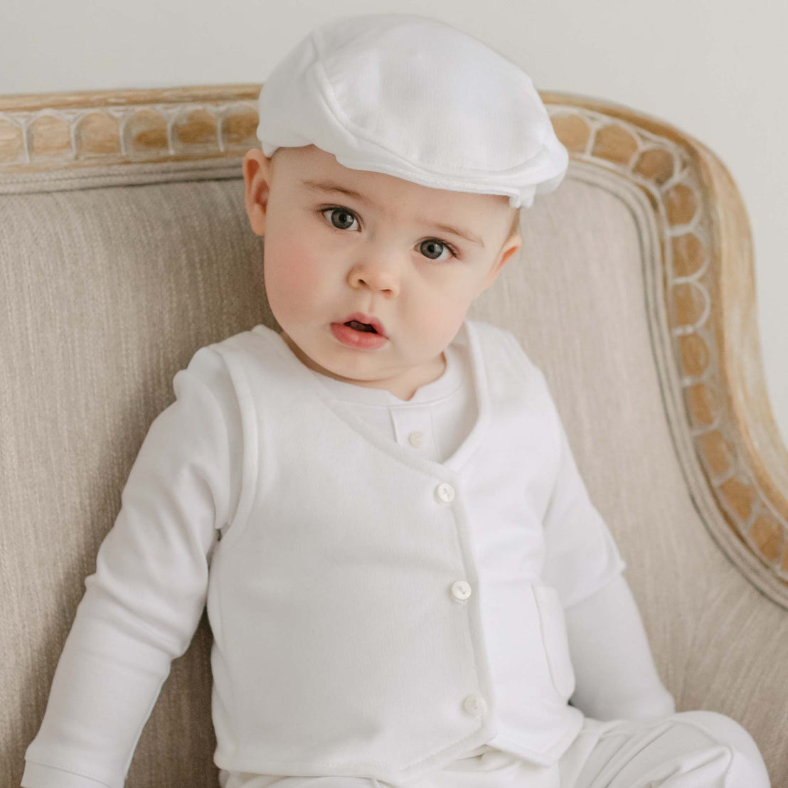 Baby boy wearing the Miles vest Suit and Newsboy Cap made with french terry in white