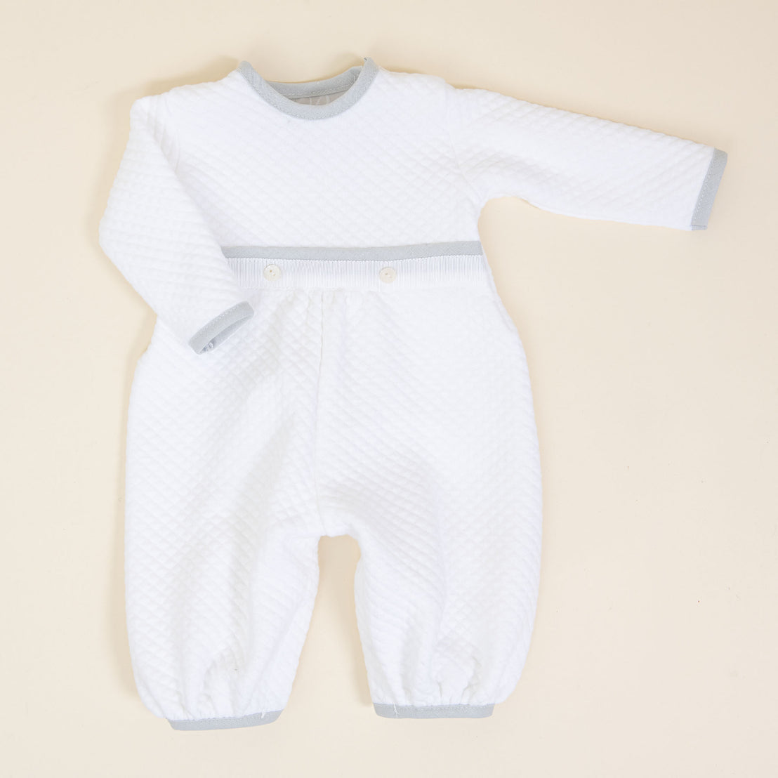 Flat lay photo of the Grayson newborn baby boy romper.