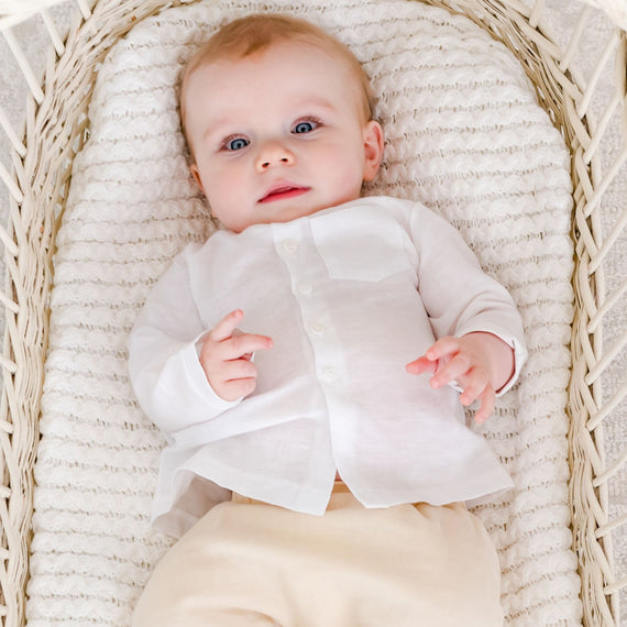 Baby boy in a crib wearing the Silas White Linen Shirt 