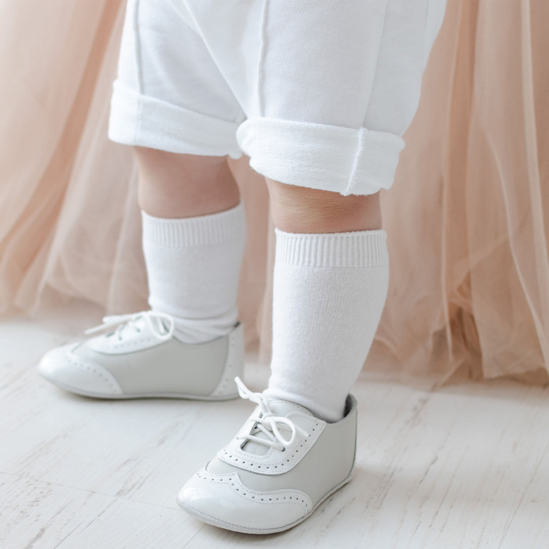 Baby boy shoes with knee high socks. 